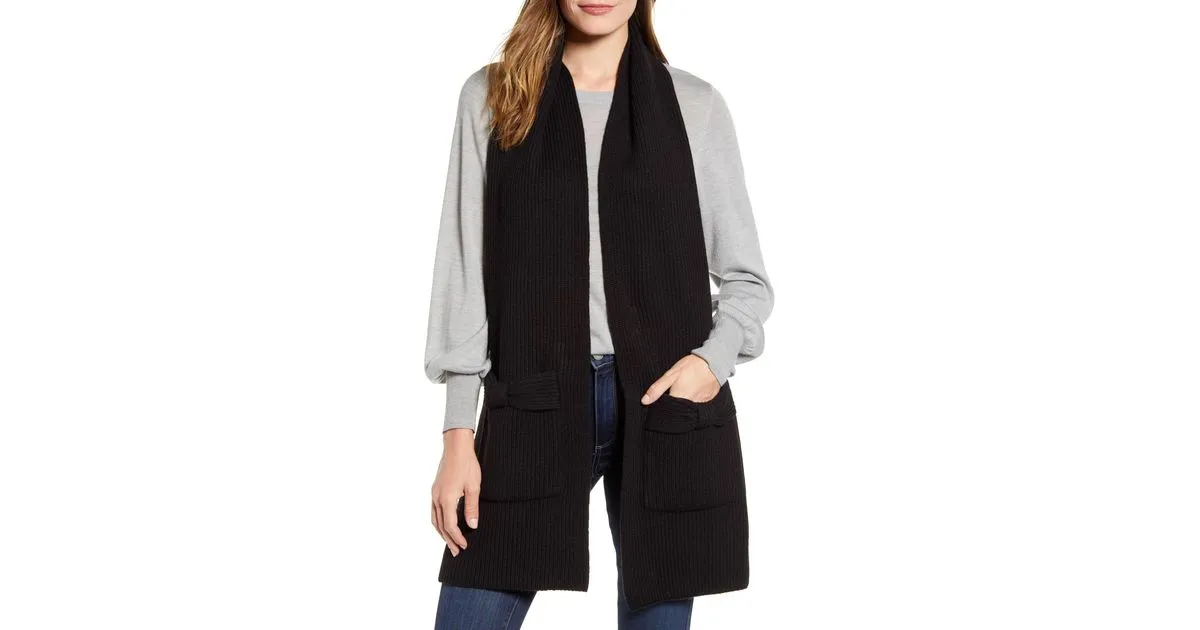 solid bow knit scarf KATE SPADE NEW YORK! Black! Pockets on both ends of the scarf, super stylish! Retails $80US 